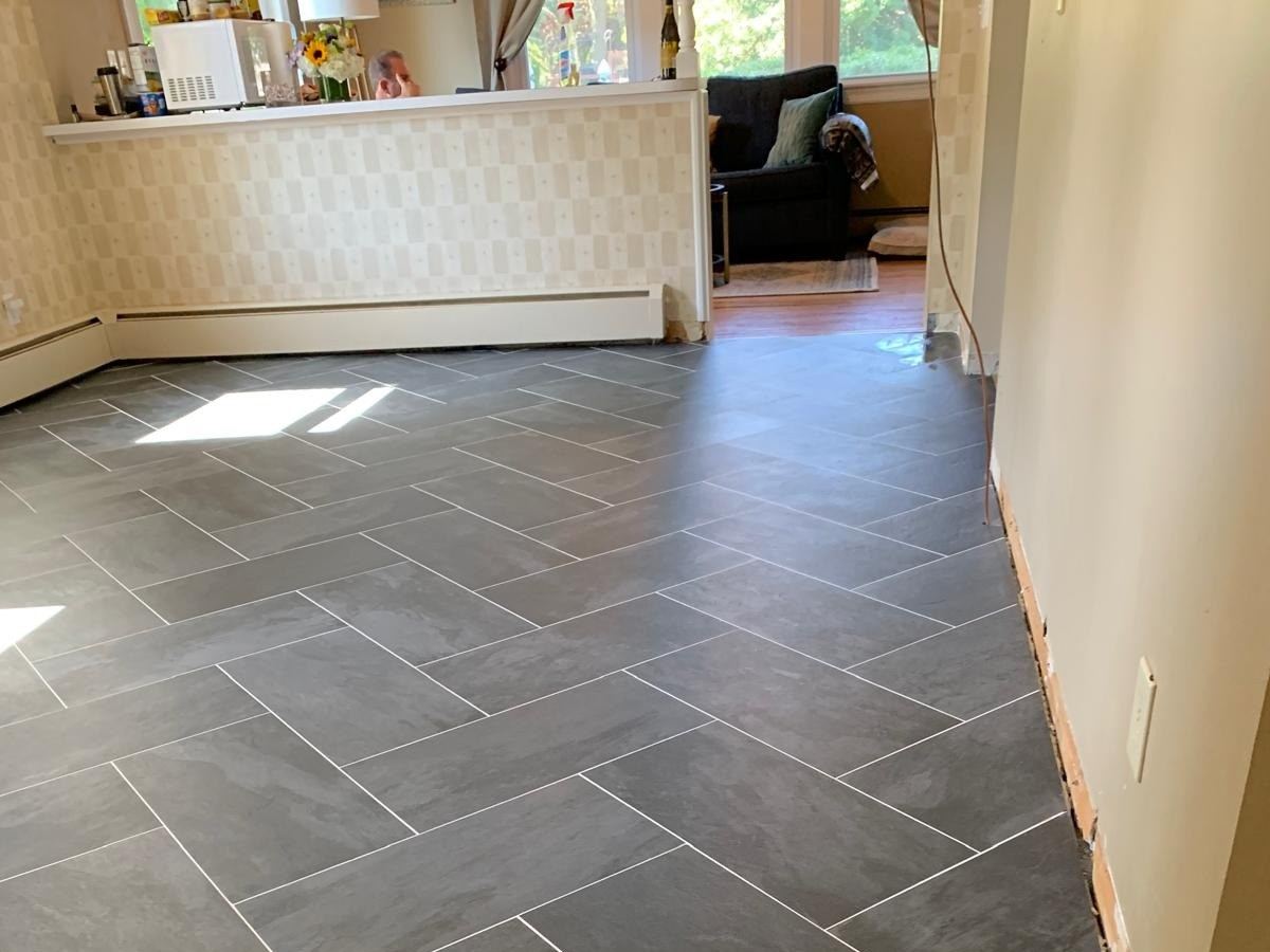 Gray porcelain-look floor tile laid in a staggered pattern